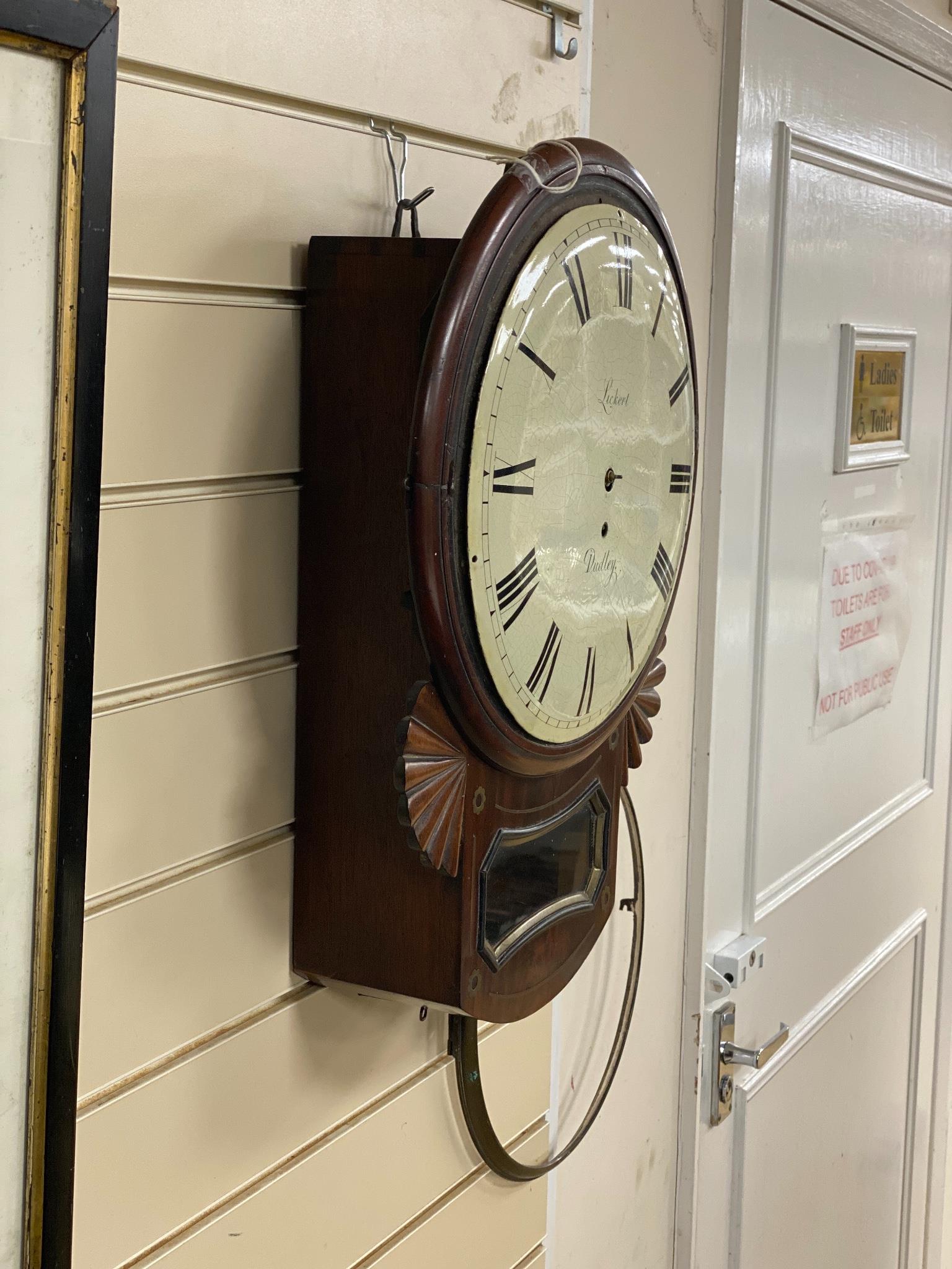 An early 19th century mahogany drop-dial wall clock, signed Sickert, Dudley (P), length 52cm